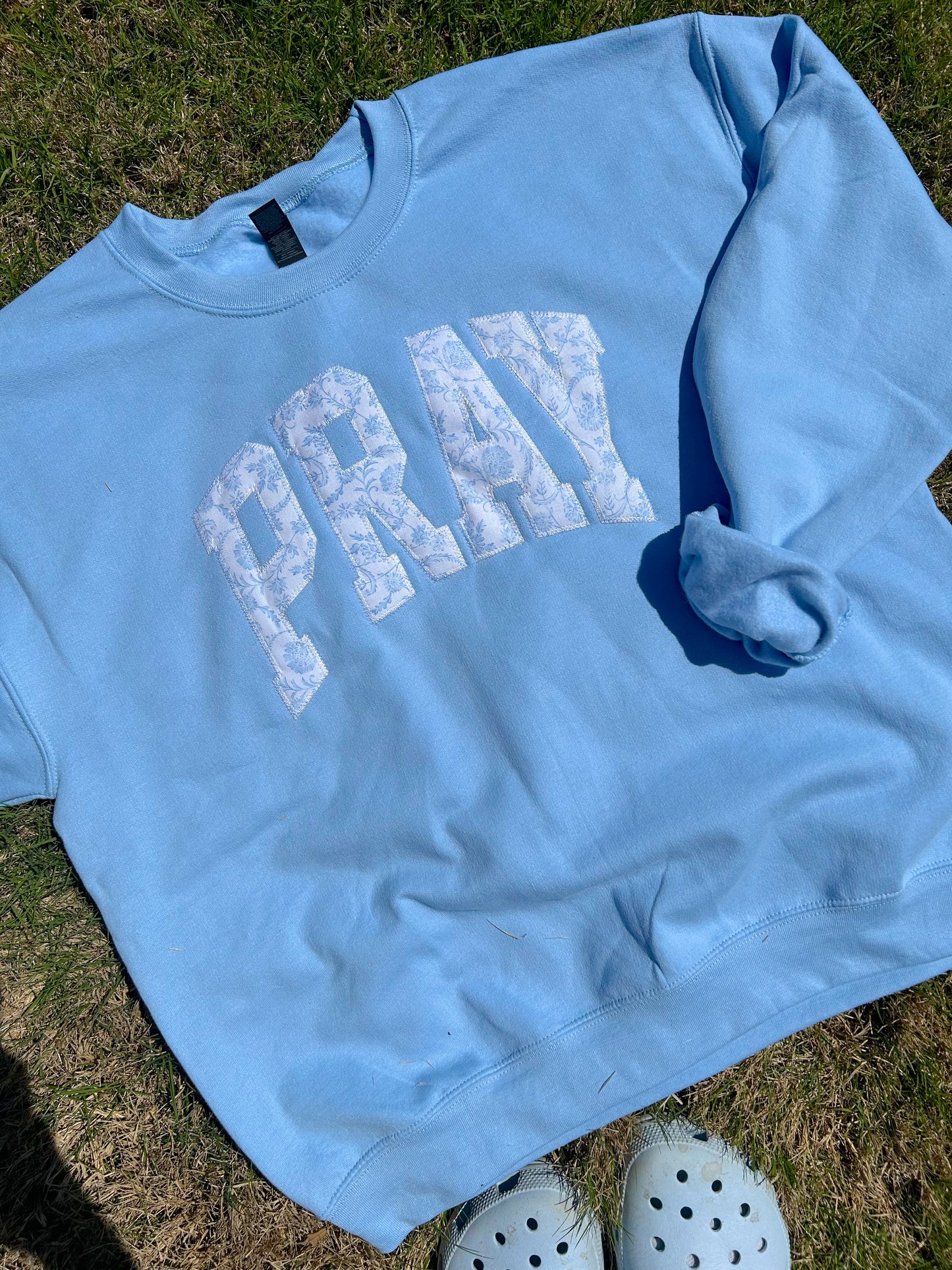 PRAY PATCHWORK BLUE SWEATSHIRT
