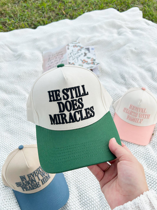 He Still Does Miracles Trucker Hat