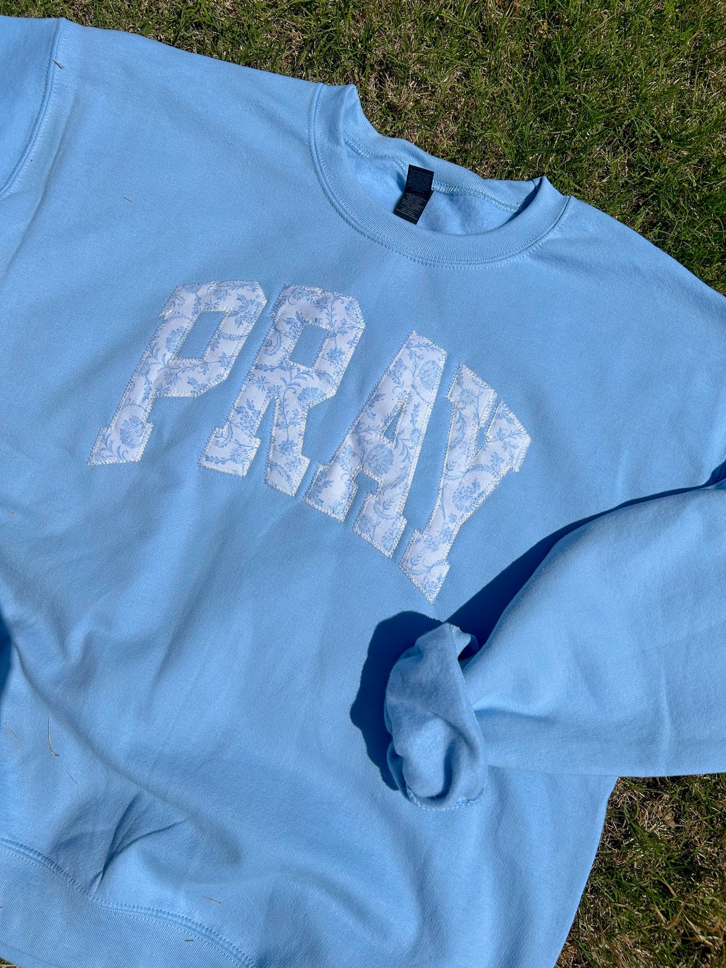 PRAY PATCHWORK BLUE SWEATSHIRT